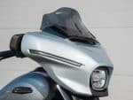 Modern Harley-Davidson motorcycle with sleek fairing and windshield for a stylish ride.