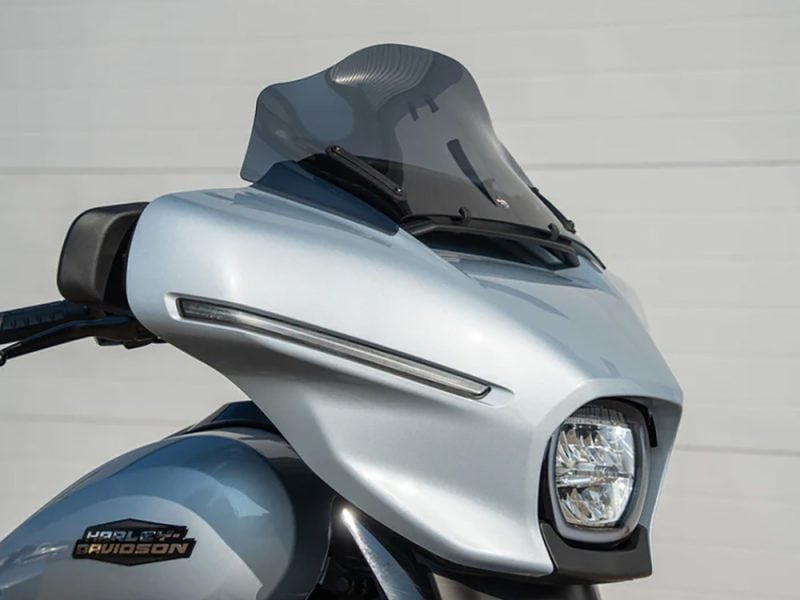 10in. Flare Windshield - Dark Smoke. Fits CVO Street Glide 2023up & Street Glide 2024up Modern Harley-Davidson motorcycle with sleek fairing and windshield for a stylish ride.