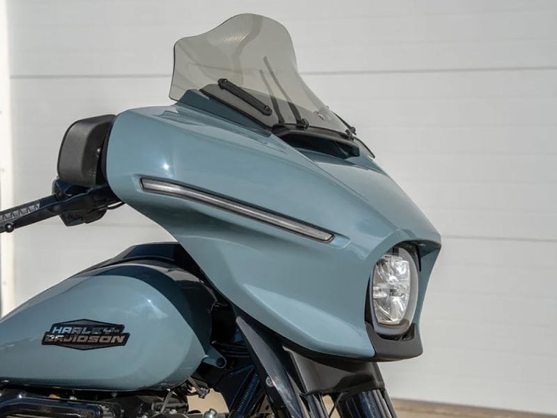 10in. Flare Windshield - Tinted. Fits CVO Street Glide 2023up & Street Glide 2024up Harley-Davidson motorcycle with modern front fairing and windshield in light blue colour.
