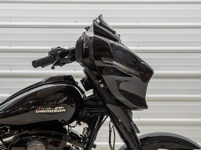 Harley Davidson motorcycle with sleek black fairing and modern design.