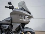 Motorcycle front view with windshield and Harley Davidson logo, highlighting premium cruiser motorcycles.