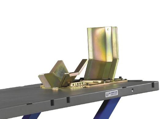 MC10R Deluxe Wheel Clamp. Fits 120 to 160 width Tyres. Adjustable motorcycle seat mounting bracket on a black workbench for bike customization.