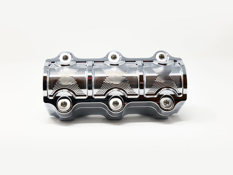 Polished motorcycle engine component from Revelry Motorcycles, high-quality and custom-designed.