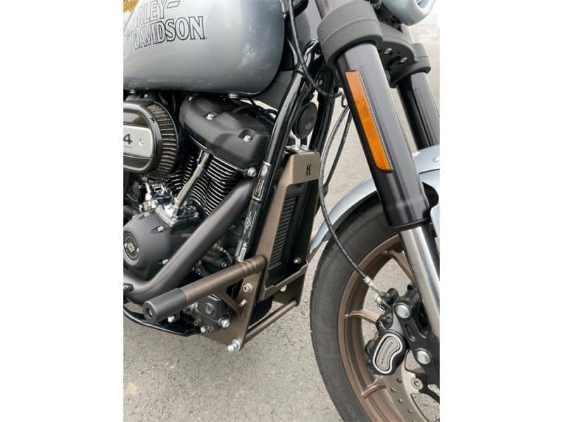 Custom Harley Davidson electric motorcycle; sleek black design, front view showcasing modern features.