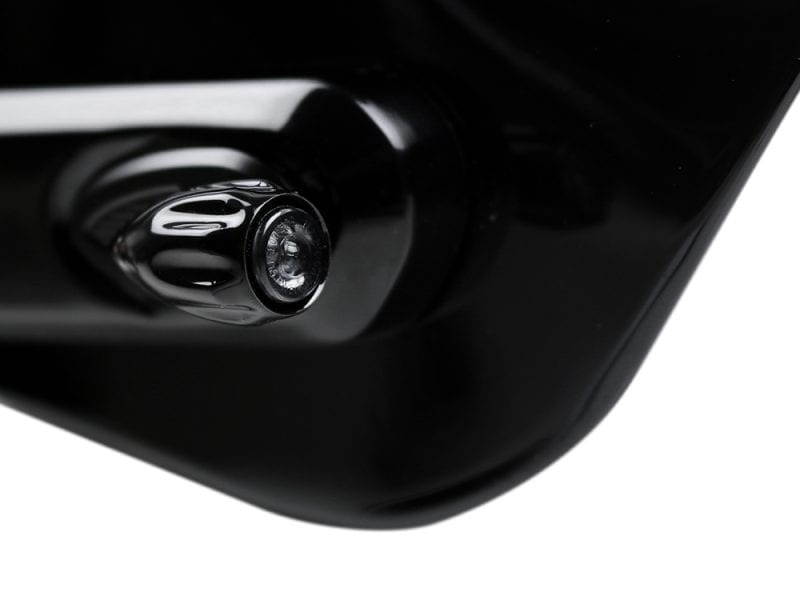 High-quality motorcycle exhaust pipe close-up shot in black and chrome finish.