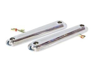 Bright chrome motorcycle tank lift blocks for custom bike styling.