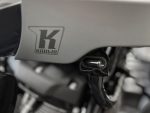 Koollin motorcycle logo on engine part, high-quality close-up shot, technology and repair focus.