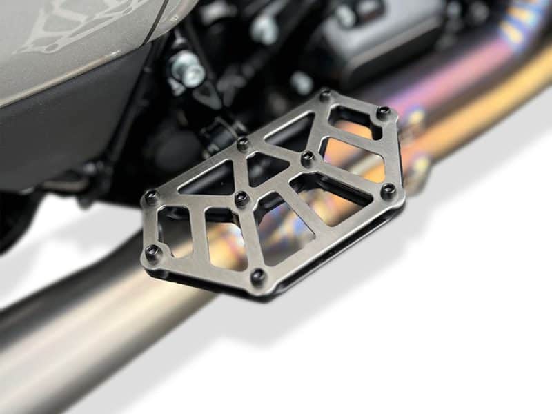 Lightweight CNC motorcycle footpeg, durable black anodised finish for Revelry Motorcycles.