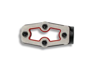 Lightweight bicycle cleat in silver and red for Revelry motorcycles, designed for optimal pedal engagement.