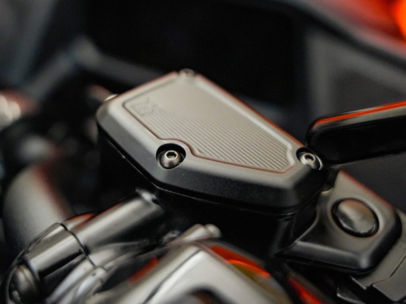 High-performance motorcycle handlebar control showing advanced digital interface.