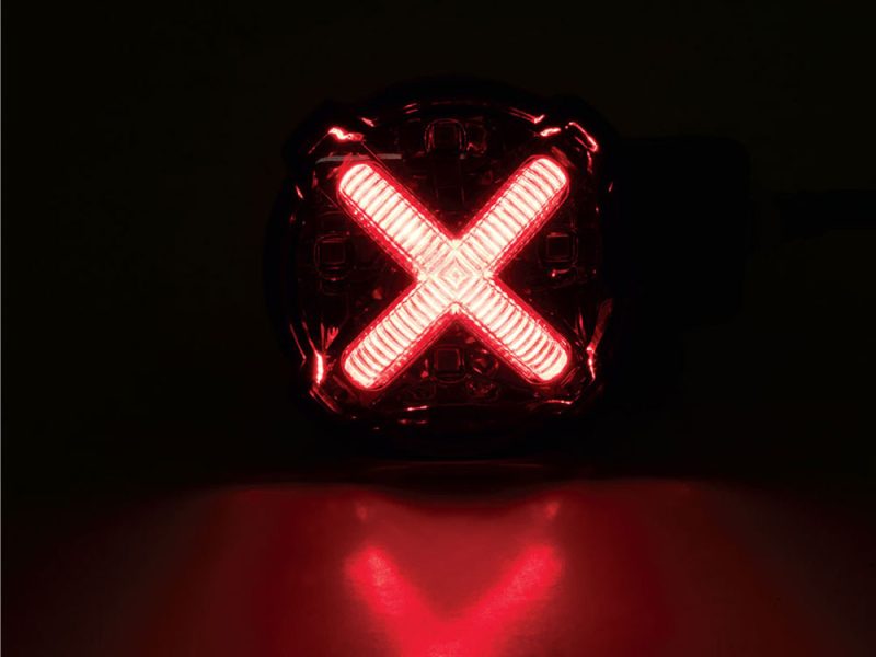 LED X bike rear marker light for motorcycles and cycling safety.