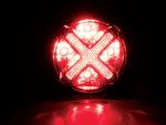 Bright red LED motorcycle tail light with custom X design, ideal for motorcycle safety and style.