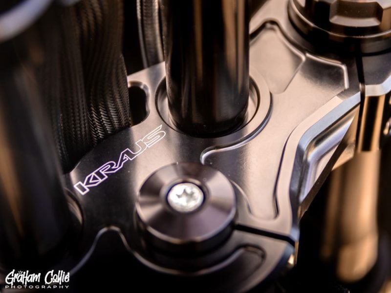 High-quality motorcycle engine close-up with Revelry Motorcycles branding, showcasing precision and craftsmanship.
