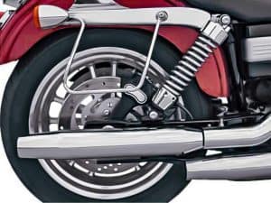 Red motorcycle rear wheel with chrome exhaust and suspension, ideal for motorcycle enthusiasts and custom bike riders.