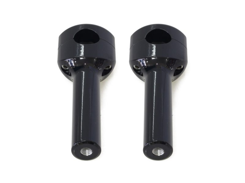 Black motorcycle handlebar risers for comfort and control.