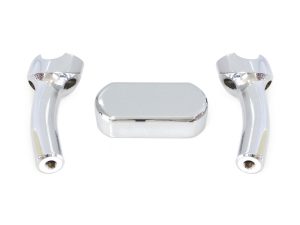 Polished chrome motorcycle handlebar risers and central cover for cruiser bikes.