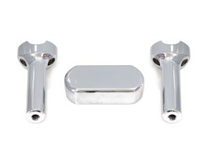 Chrome motorcycle handlebar risers and reservoir cover set for Revelry Motorcycles.