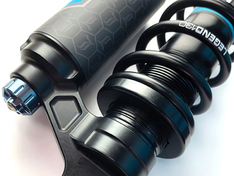High-performance Revelry motorcycle suspension shock absorber for optimal ride quality.