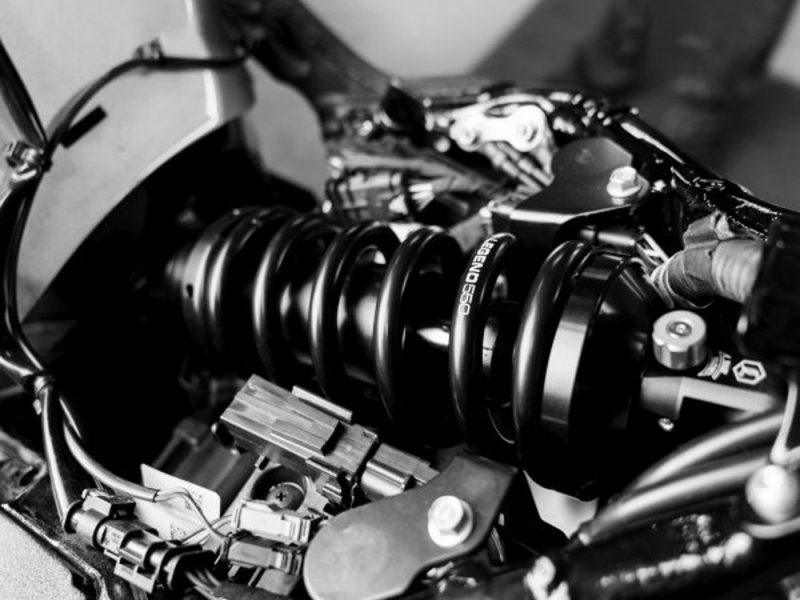 High-performance motorcycle suspension close-up, essential for smooth rides and handling.