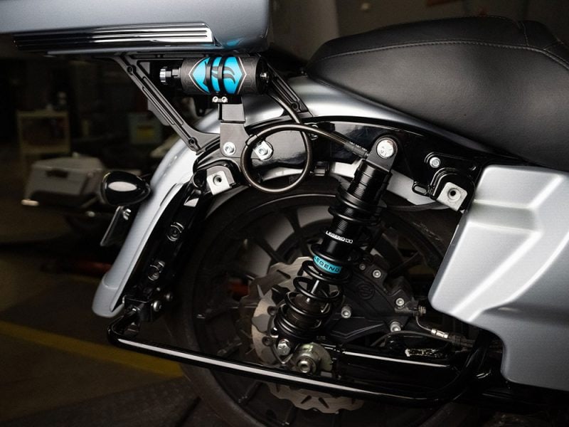 High-performance motorcycle suspension and rear shock absorber at Revelry Motorcycles, specialised in custom bikes.