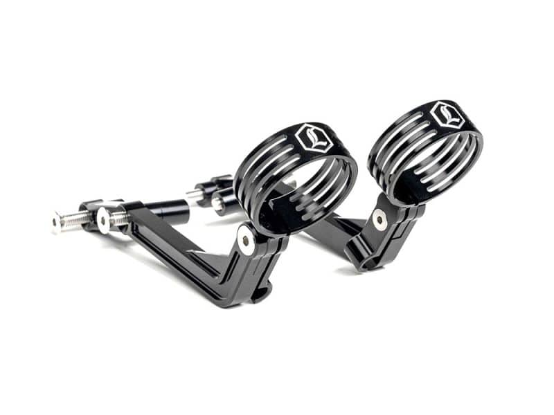 High-performance motorcycle foot pegs with sleek black design and chrome accents.