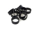 Black rubber swingarm bushings for motorcycle maintenance and upgrades.