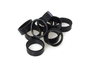 Black rubber swingarm bushings for motorcycle maintenance and upgrades.