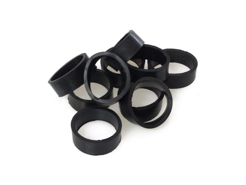 Black rubber swingarm bushings for motorcycle maintenance and upgrades.