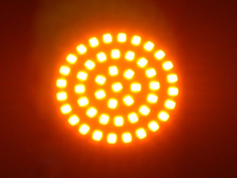 Bright orange motorcycle LED tail light for Revelry Motorcycles, Australian custom bike accessories.