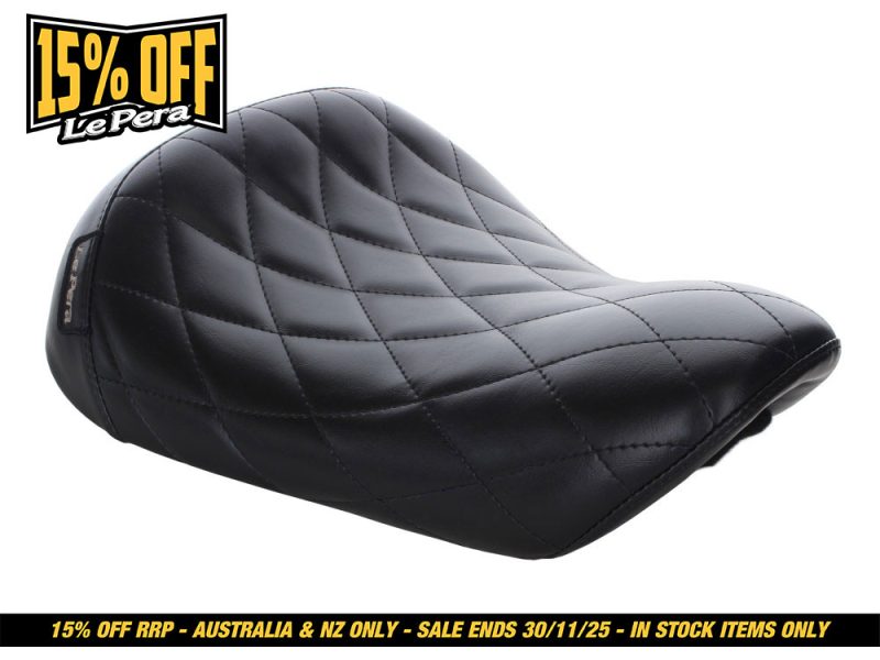 Black quilted motorcycle seat from Revelry Motorcycles, stylish and comfortable for bike enthusiasts.
