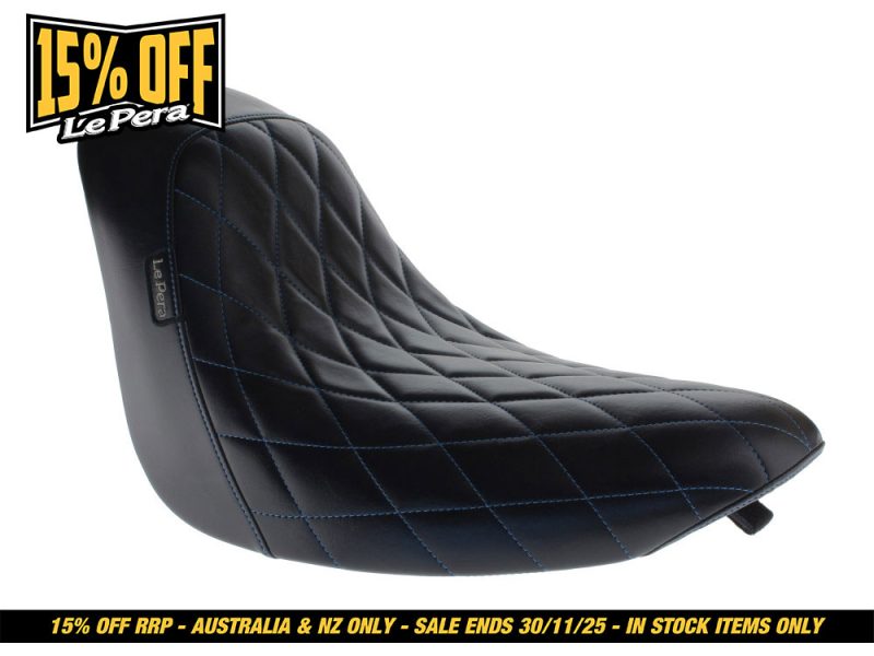 Black quilted motorcycle seat for Harley Davidson bikes, stylish and comfortable riding accessory.