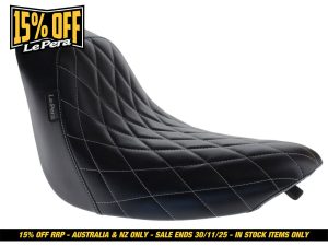 Stylish black quilted motorcycle seat with diamond stitching for Harley Davidson bikes.