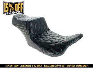 Black motorcycle seat with diamond stitching, ideal for café racers and custom bikes.