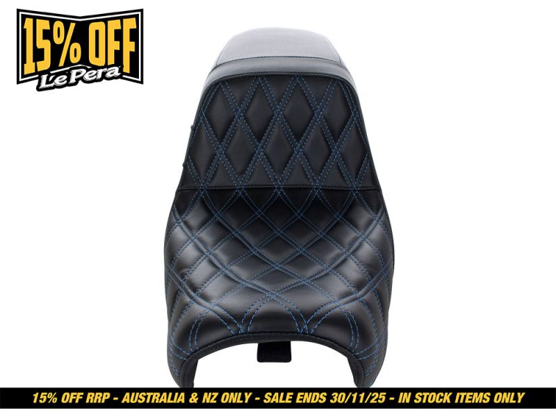 Black quilted motorcycle seat with blue stitching for Revelry Motorcycles.