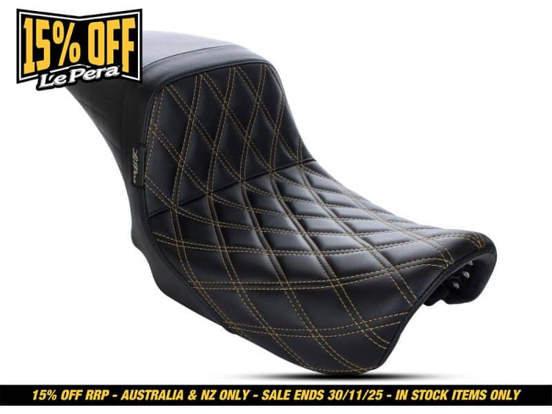 Black motorcycle seat with yellow stitching, custom comfort padding for motorcycles.