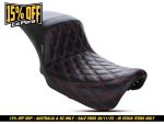Leather motorcycle seat with red stitching for classic cruiser bikes.