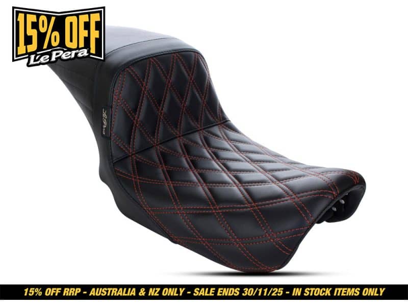 Leather motorcycle seat with red stitching for classic cruiser bikes.