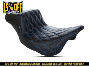 Black quilted motorcycle seat with blue stitching for Harley Davidson bikes, premium custom motorcycle seat, Revelry Motorcycles.
