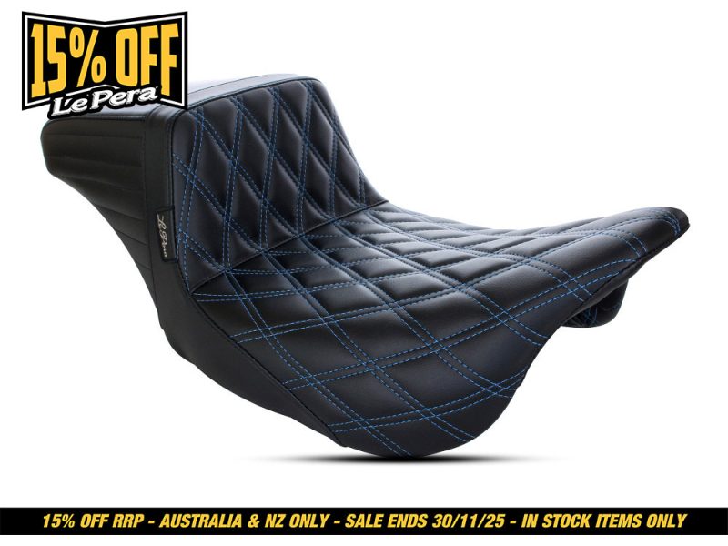 Black quilted motorcycle seat with blue stitching, ideal for Revelry motorbike accessories and custom bikes.