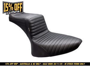 Black leather motorcycle seat with ribbed stitching, ideal for custom bikes and cruisers.