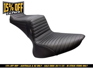 Black motorcycle seat with quilted stitching, designed for Harley Davidson bikes.