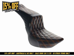 Luxury black and orange quilted motorcycle seat for Harley-Davidson and custom bikes.