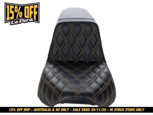 Black quilted motorcycle seat for Revelry Motorcycles, stylish and comfortable.