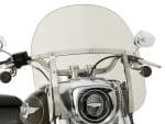 Vintage motorcycle with clear windscreen and chrome accents, perfect for cruising.