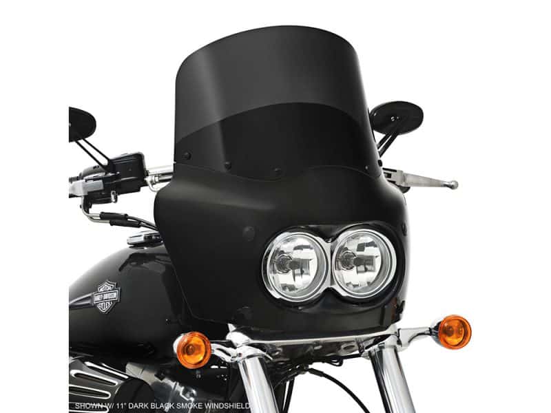 Dark black motorcycle windscreen with dual headlights and Harley-Davidson logo at Revelry Cycles.