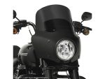 Dark black motorcycle windshield for Harley-Davidson touring bikes, enhancing style and protection.