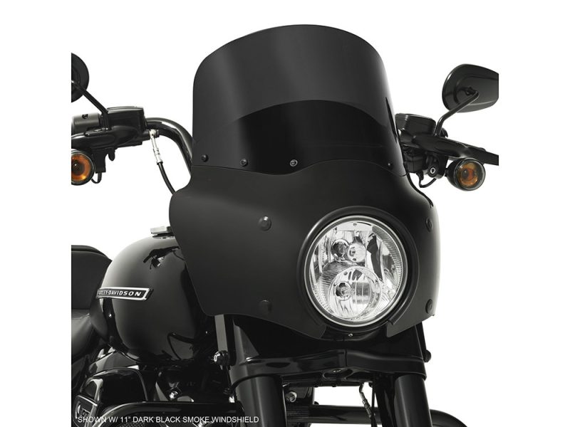 Dark black motorcycle windshield for Harley-Davidson touring bikes, enhancing style and protection.
