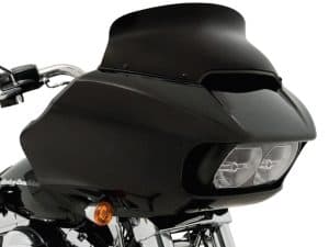 Black touring motorcycle fairing with dual headlights for Harley Davidson touring bikes, designed for improved aerodynamics and rider comfort.