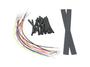 Multicoloured motorcycle wiring harness kit with rubber spacers and heat shrink tubing at Revelry Motorcycles.