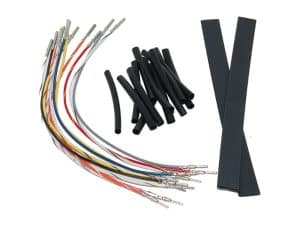 Multi-coloured motorcycle wiring loom with black rubber tubing and connectors for custom motorcycle builds.